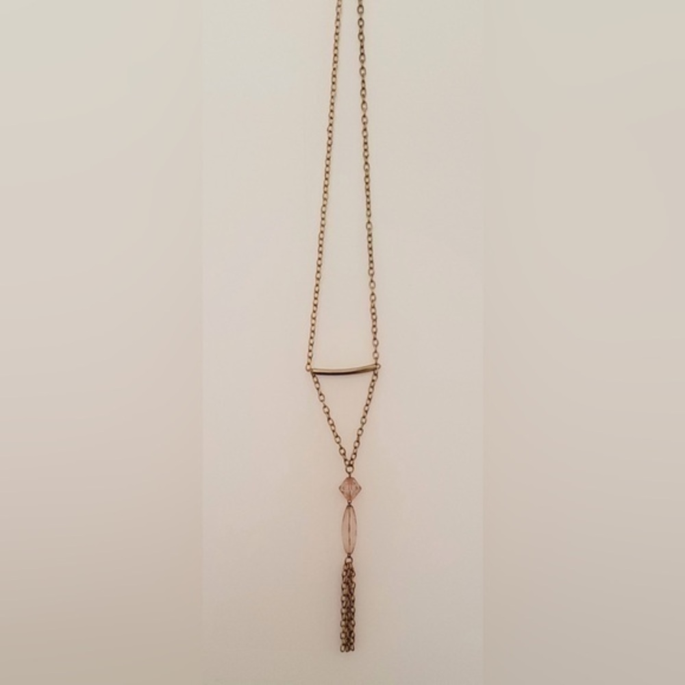 Very long 22” golden necklace with bead and tassel.